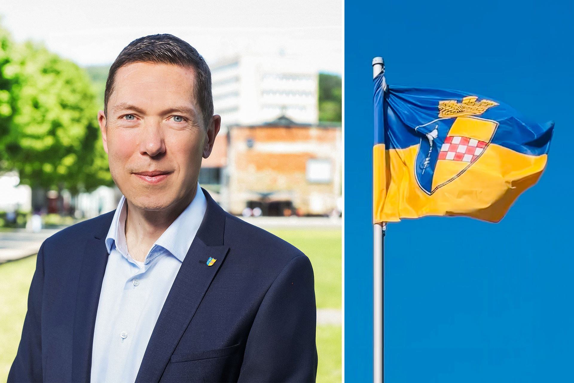 Raoul Halding-Hoppenheit neben der  Stadtflagge von Gummersbach